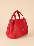 Borsa a mano Charro rossa su fondo beige sabbia