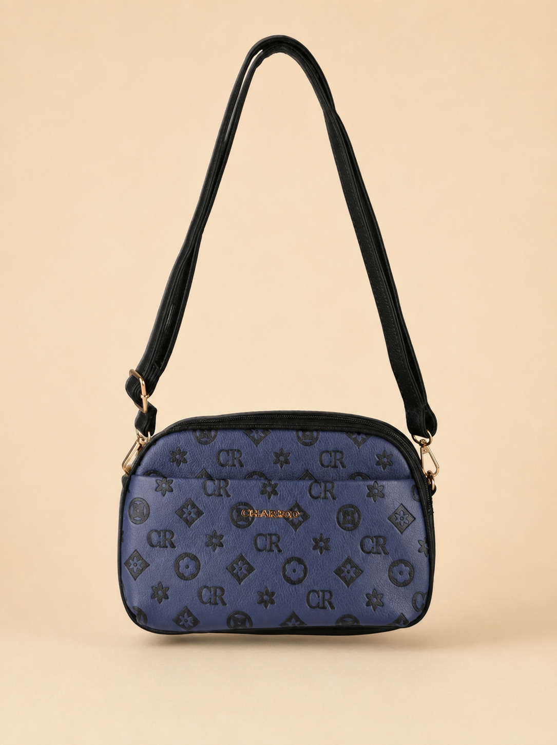 Borsa a tracolla Charro blu scuro e nera su fondo beige sabbia