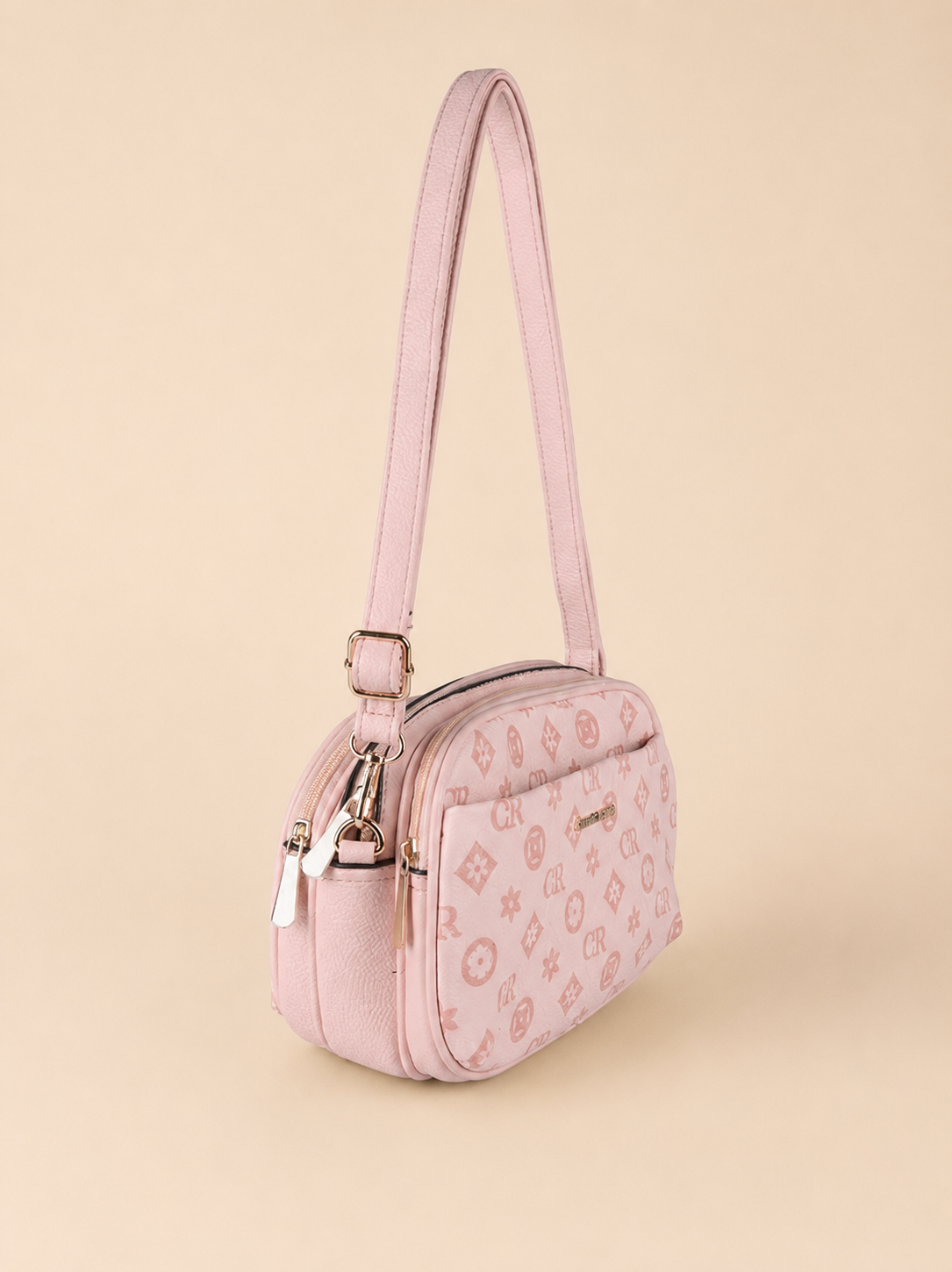 Borsa a tracolla Charro rosa con logo su fondo beige sabbia